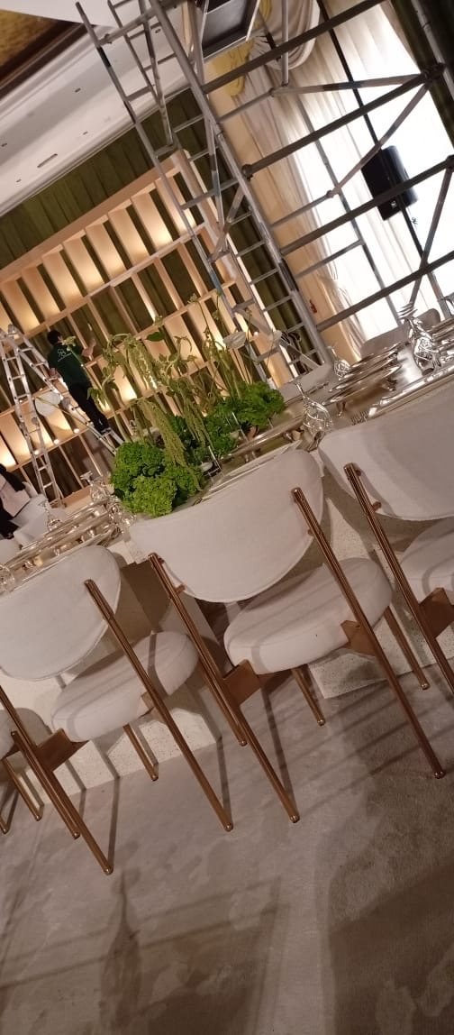 Long table with cream and gold chairs